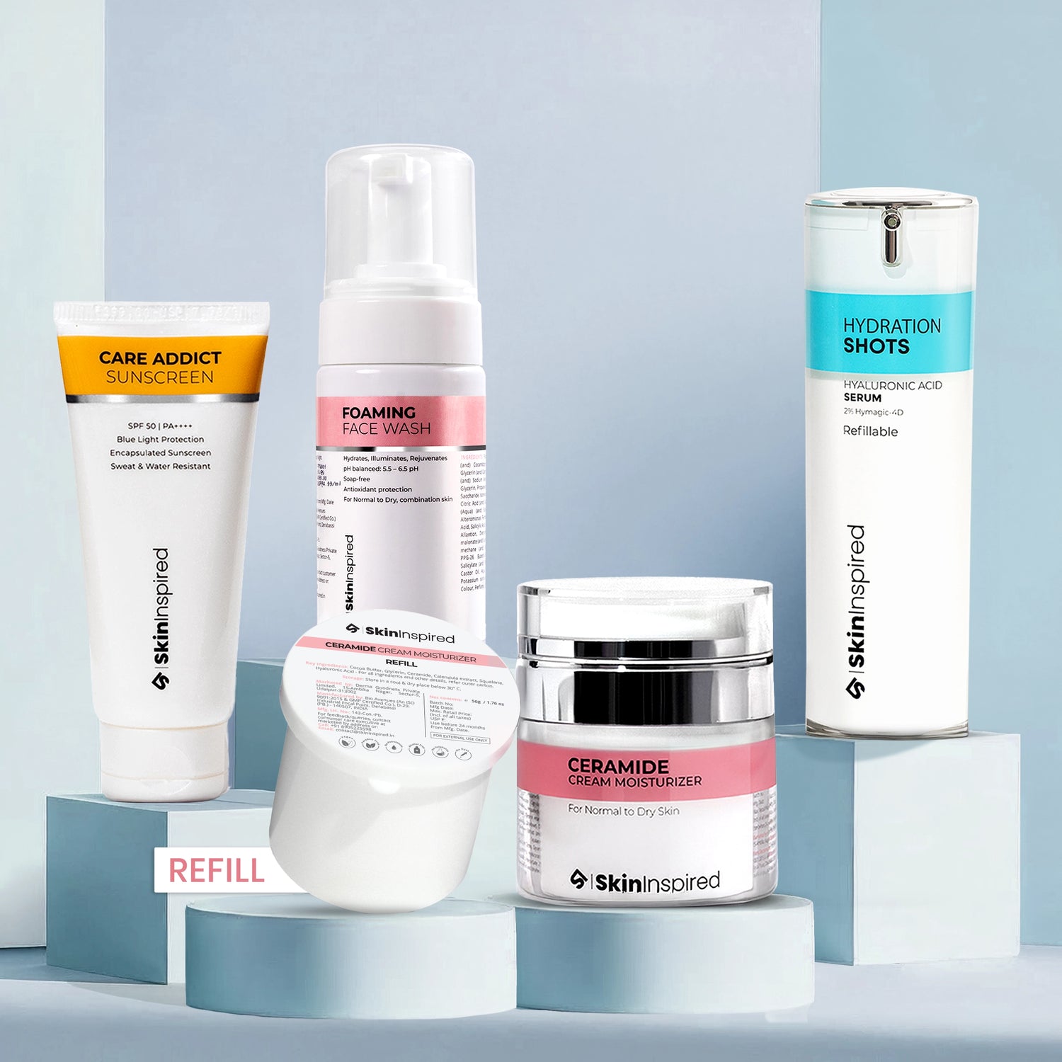 Collection of skincare products from Skininspired on a light blue background