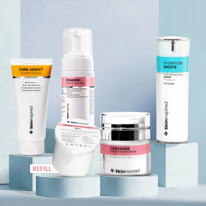 Collection of skincare products from Skininspired on a light blue background